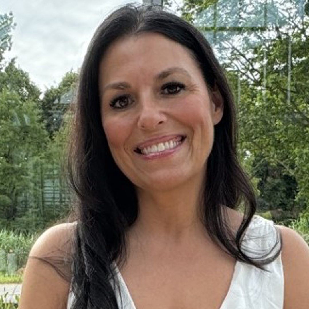 Marion Cooper Woman with white shirt and tress in background - Marion Cooper.